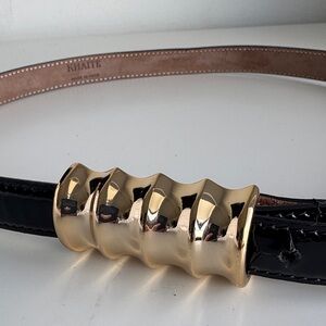 KHAITE Belt Glossy Black with Sculpted Gold Buckle.